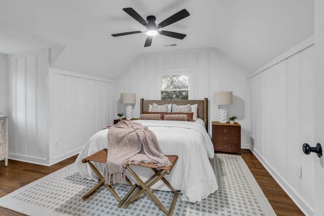 a bed room with a bed and a window