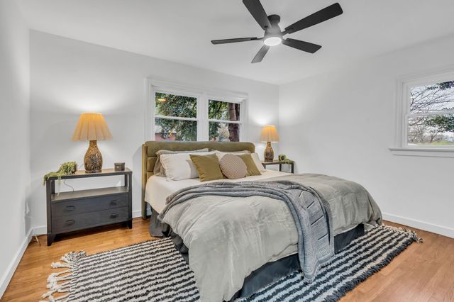 a bed room with bed and a window