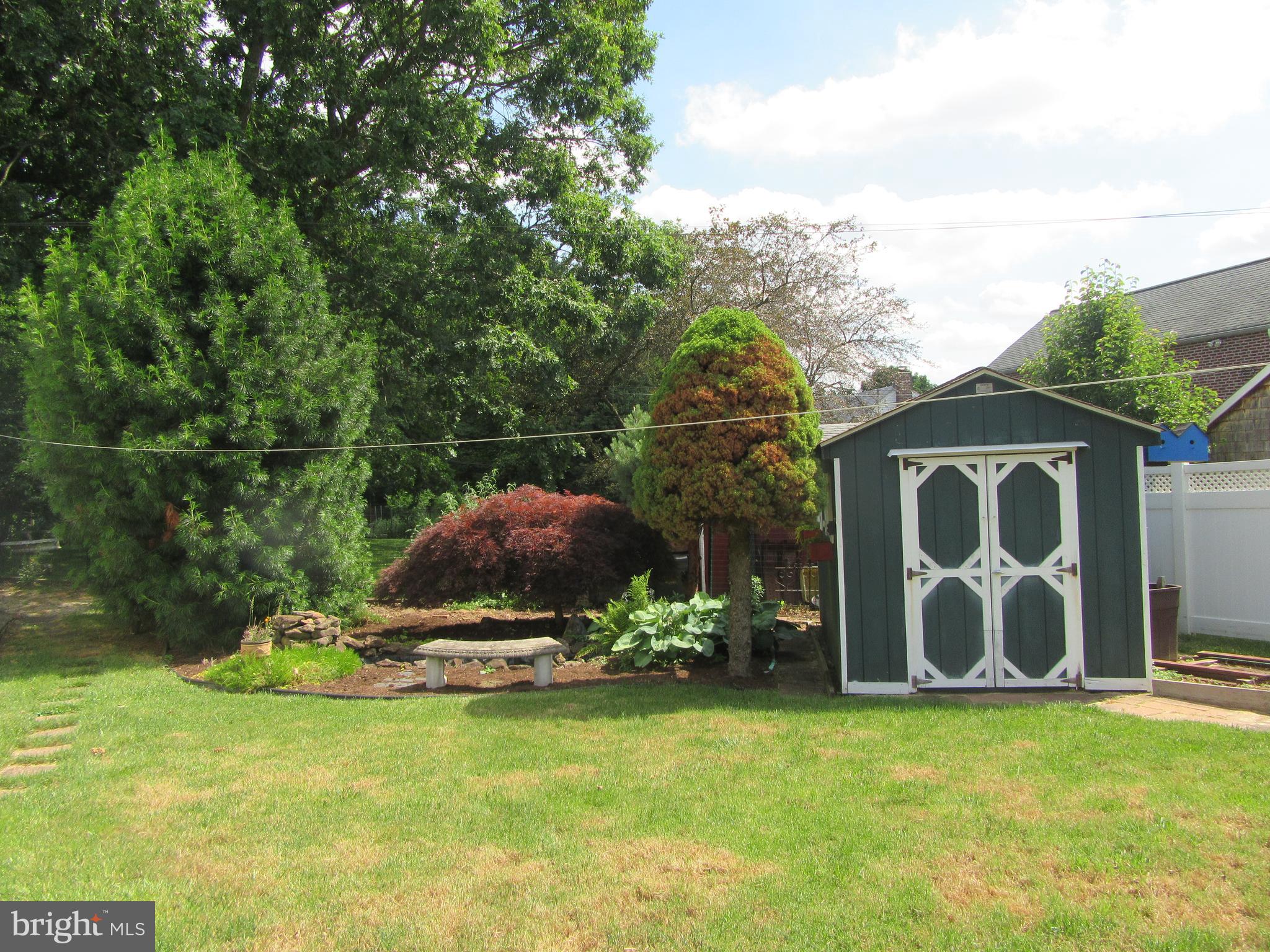 521 Sherman Road Springfield, PA 19064 - Photo 28 of 28 Landscaped rear yard with Goldfish Pond