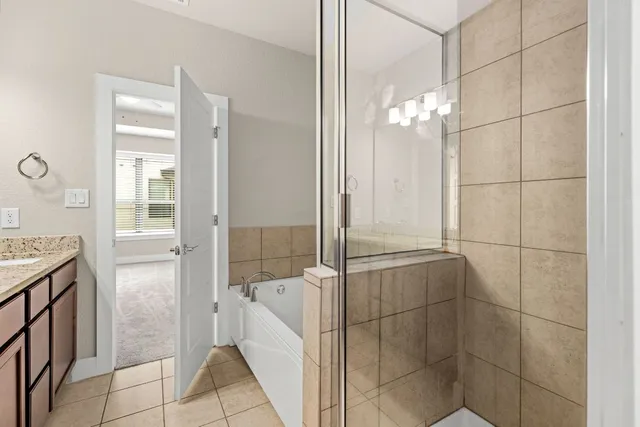 a bathroom with a bathtub and a shower