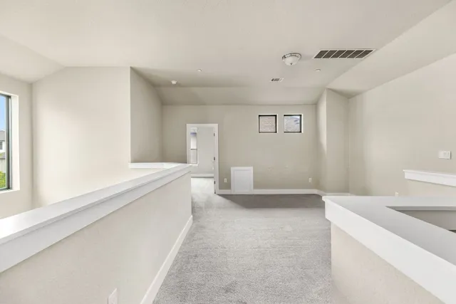 a spacious bathroom with a bathtub and a sink