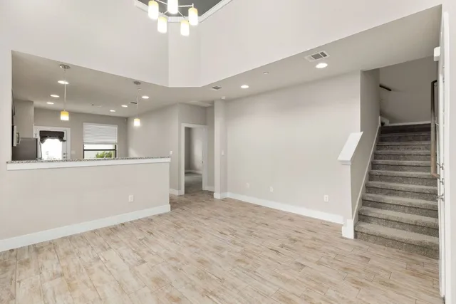 a view of a hallway with a kitchen