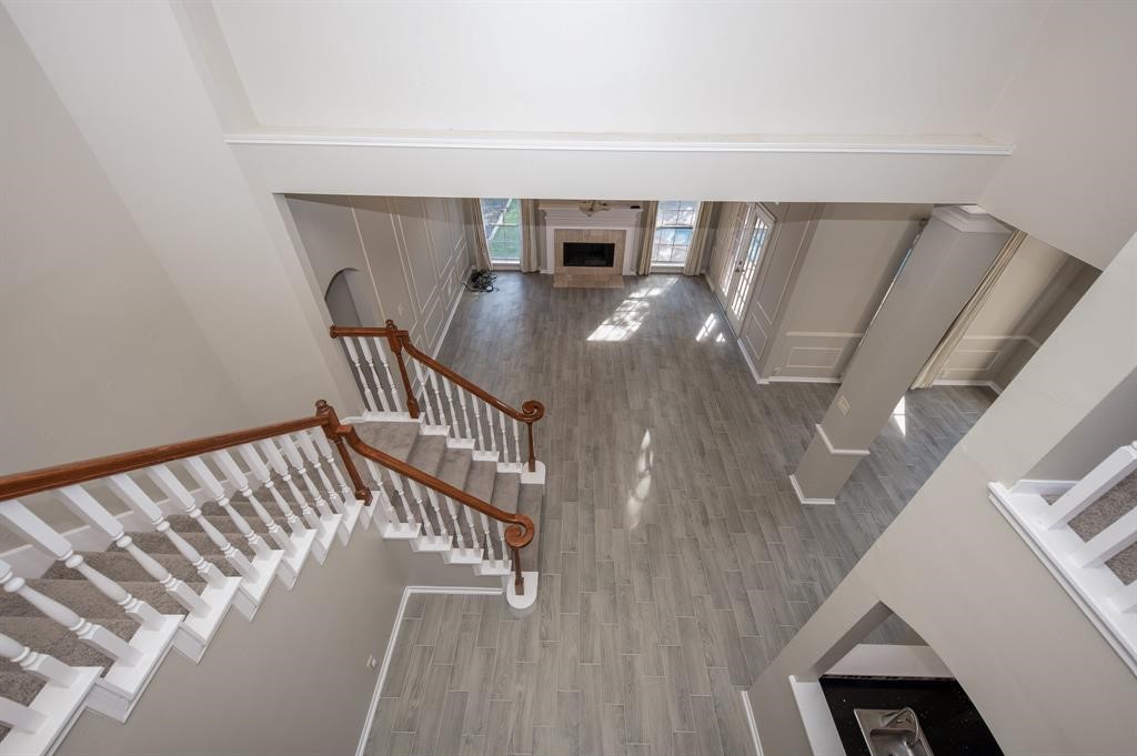 11527 Earley Forest Lane Houston, TX 77043 - Photo 20 of 32 View from the top of the staircase overlooking the family room