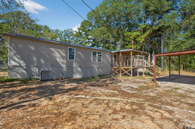a view of a barn in a yard