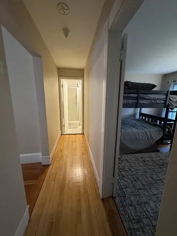 a view of washer and dryer with wooden floor