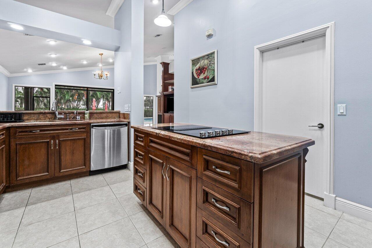 4335 Bocaire Boulevard Boca Raton, FL 33487 - Photo 12 of 55 a kitchen with a stove sink and cabinets