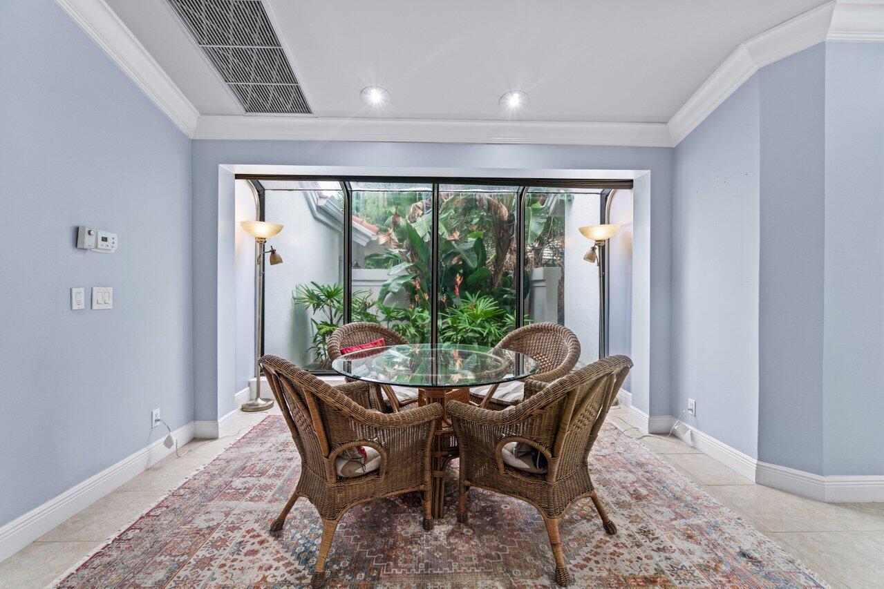 4335 Bocaire Boulevard Boca Raton, FL 33487 - Photo 13 of 55 a dining room with furniture window and outside view
