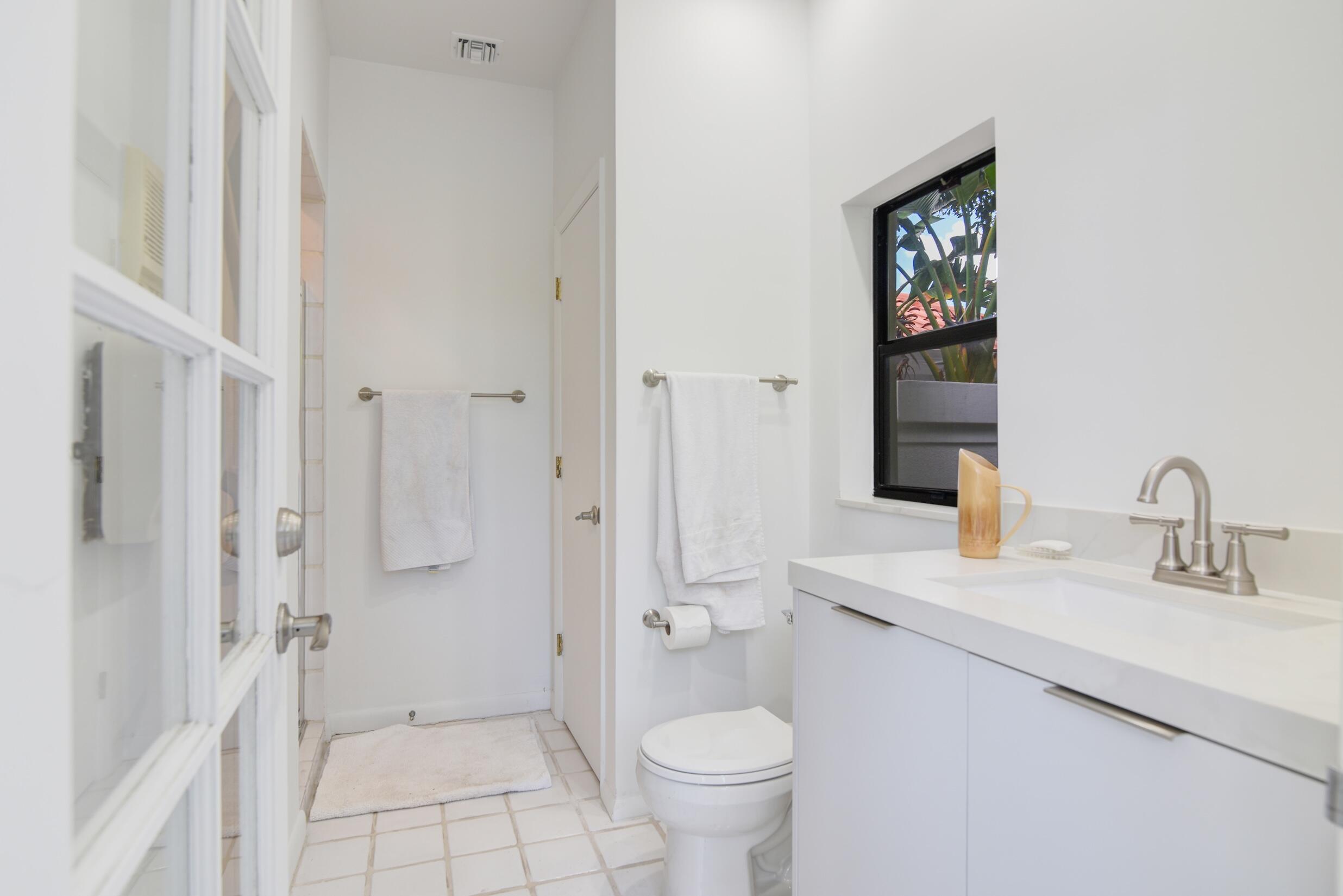 4335 Bocaire Boulevard Boca Raton, FL 33487 - Photo 18 of 55 a bathroom with a sink toilet and shower
