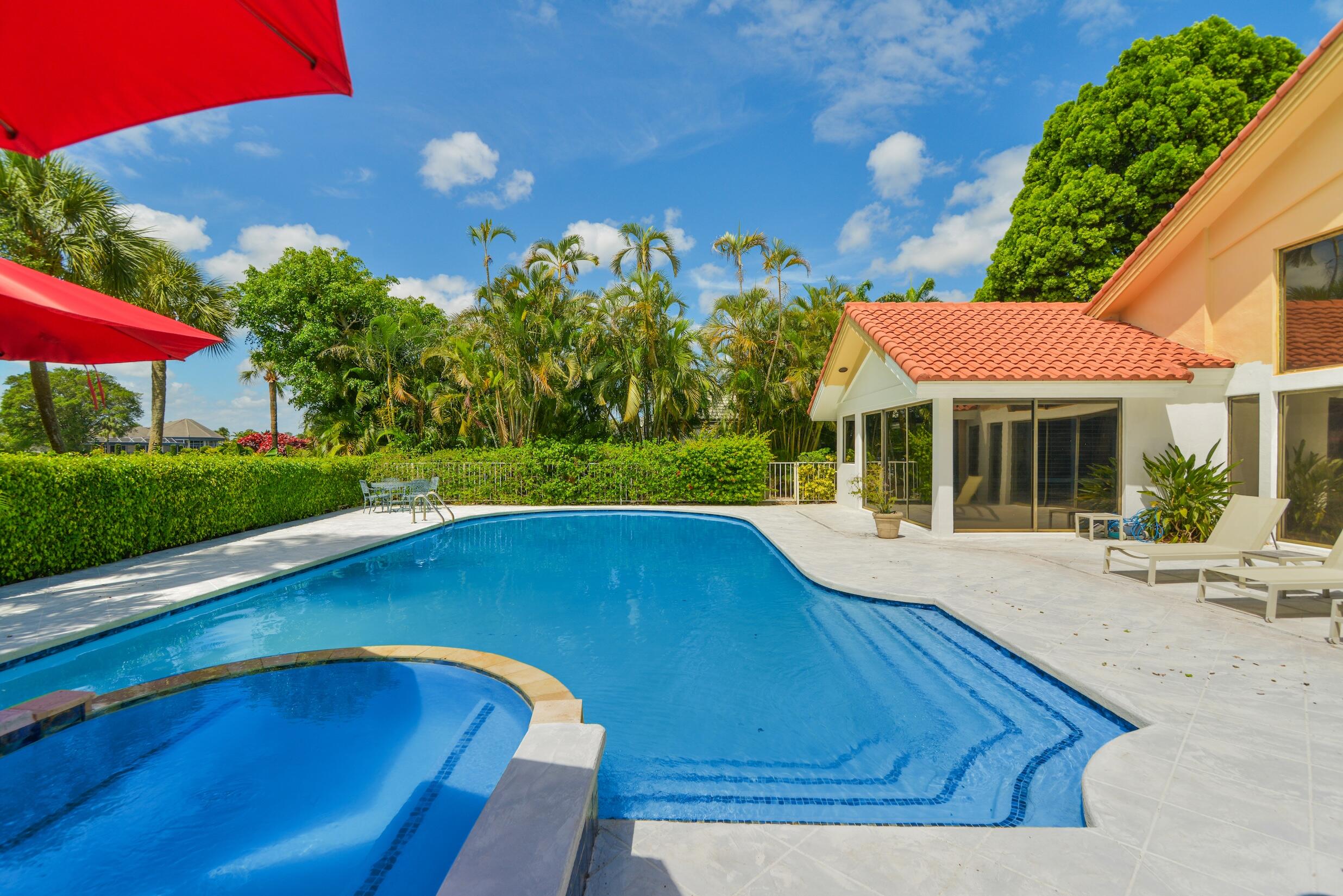 4335 Bocaire Boulevard Boca Raton, FL 33487 - Photo 24 of 55 a view of backyard with swimming pool and outdoor seating