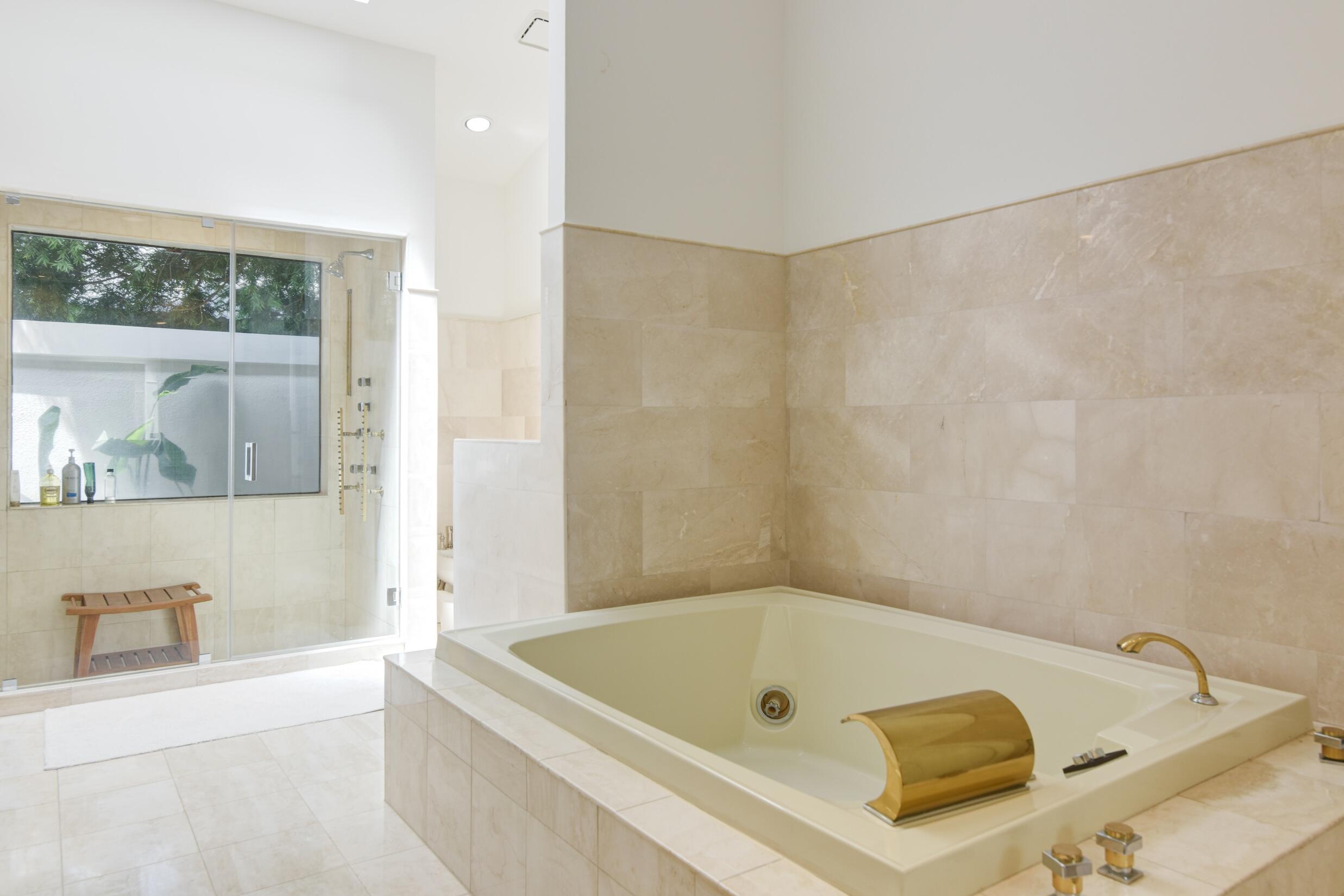4335 Bocaire Boulevard Boca Raton, FL 33487 - Photo 35 of 55 a bath tub sitting next to a window