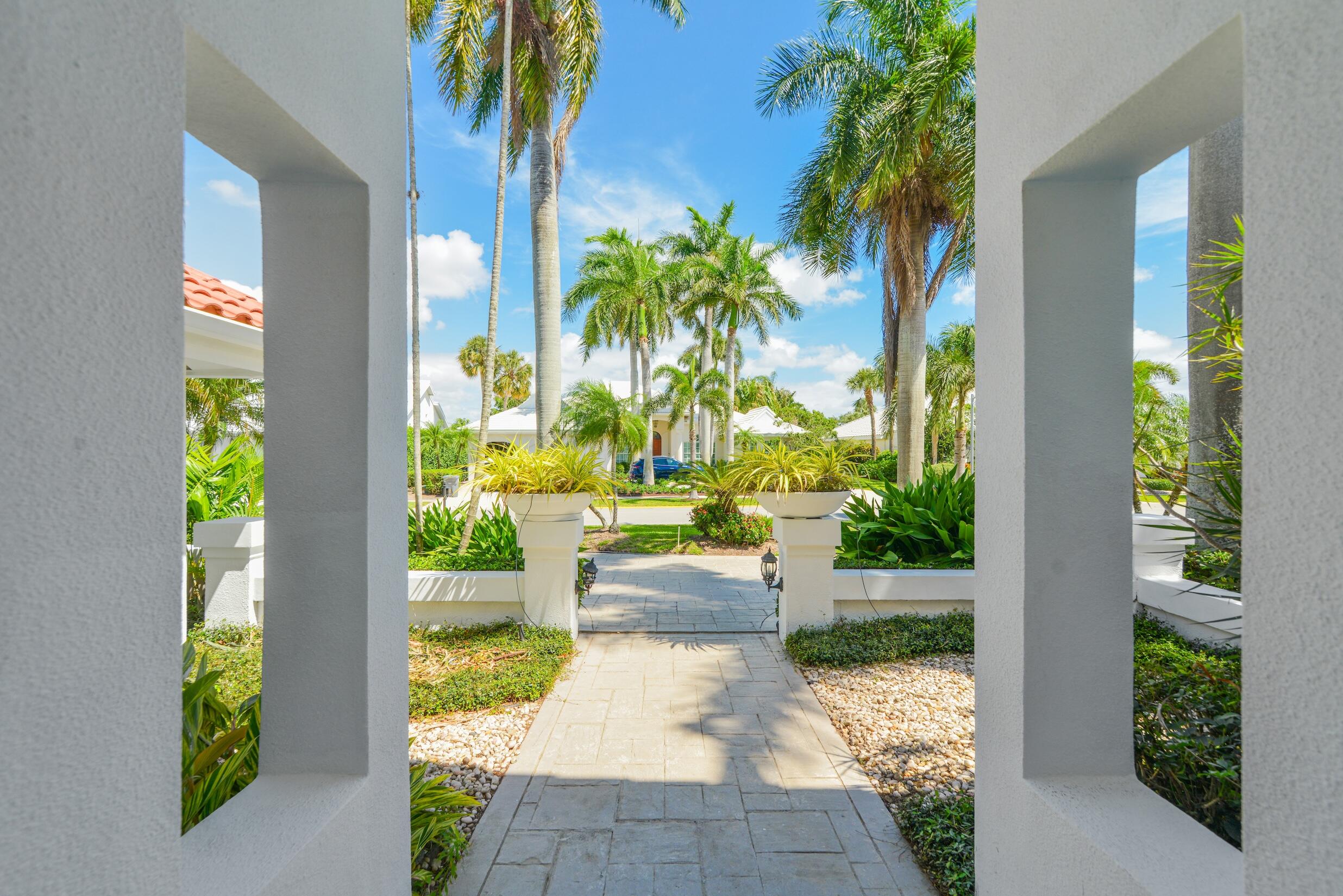 4335 Bocaire Boulevard Boca Raton, FL 33487 - Photo 7 of 55 a view of a porch with chairs and potted plants