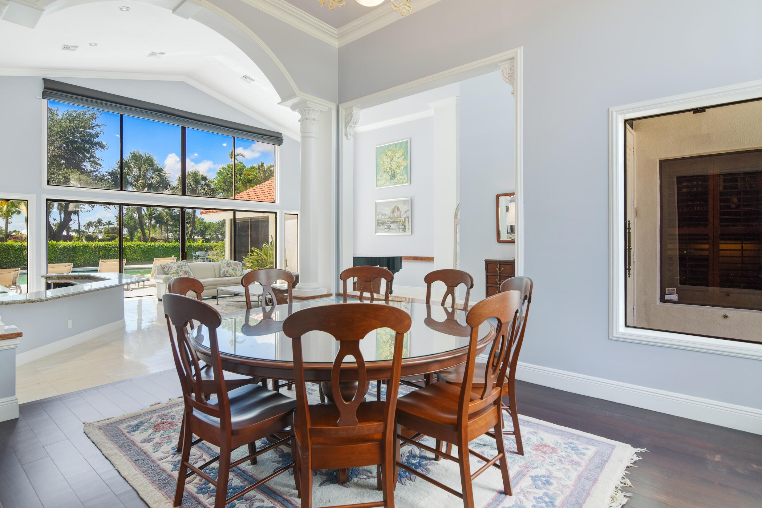 4335 Bocaire Boulevard Boca Raton, FL 33487 - Photo 10 of 55 a dining room with furniture a rug and a large window