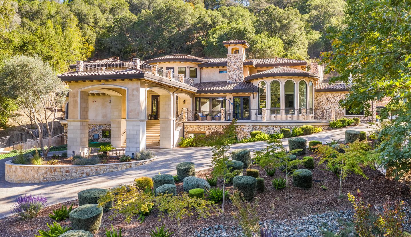 a front view of a house with a yard