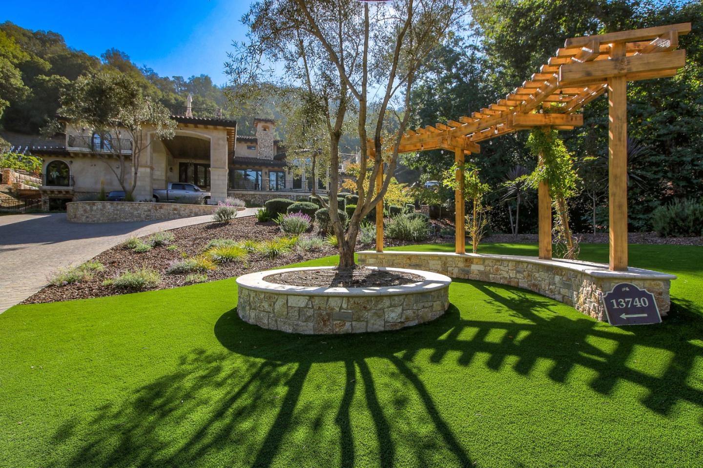 13740 Pierce Road Saratoga, CA 95070 - Photo 15 of 100 a swimming pool with outdoor seating and yard