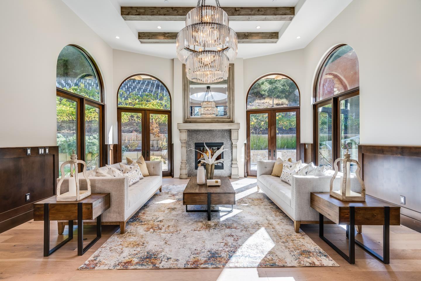 13740 Pierce Road Saratoga, CA 95070 - Photo 2 of 100 a living room with furniture a large window and a chandelier