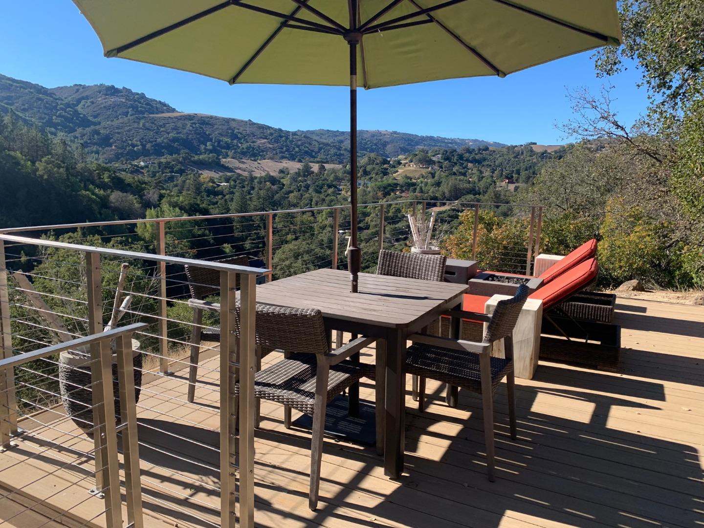 13740 Pierce Road Saratoga, CA 95070 - Photo 47 of 100 a view of a roof deck with furniture and a umbrella