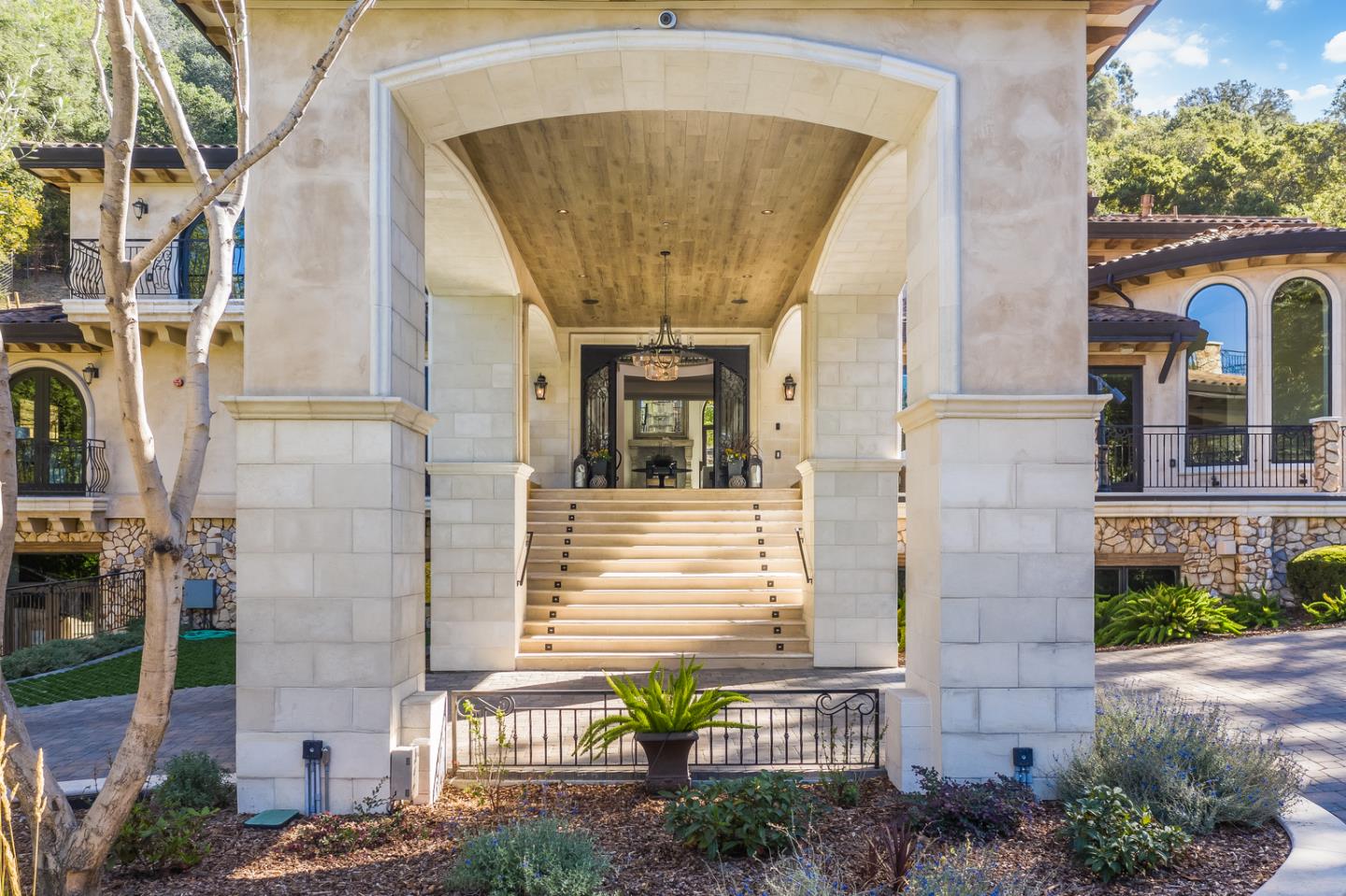 13740 Pierce Road Saratoga, CA 95070 - Photo 7 of 100 a front view of a house with large windows