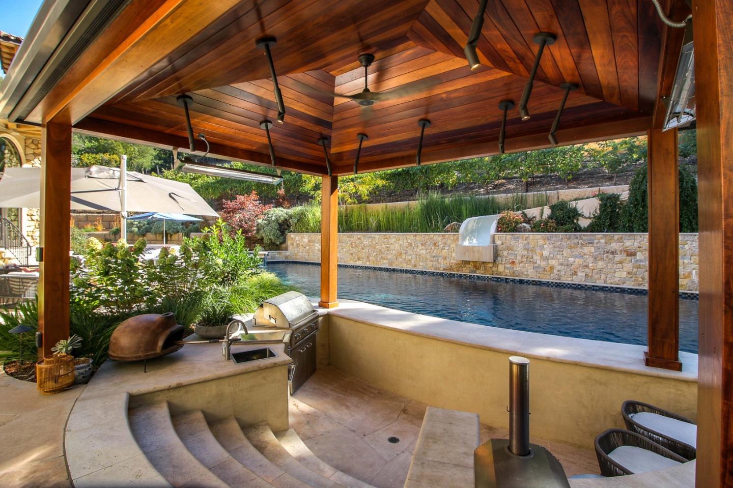 13740 Pierce Road Saratoga, CA 95070 - Photo 72 of 100 a view of a swimming pool with a patio