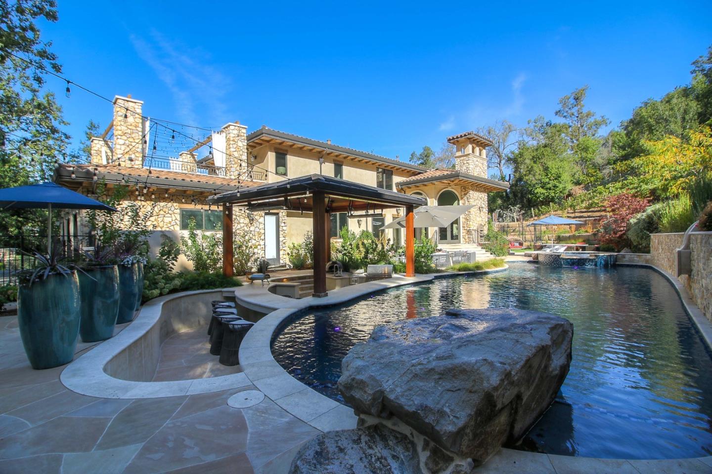 13740 Pierce Road Saratoga, CA 95070 - Photo 87 of 100 a view of a swimming pool with a patio