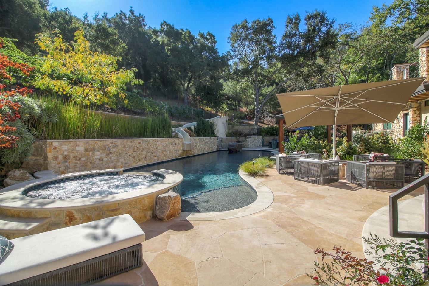 13740 Pierce Road Saratoga, CA 95070 - Photo 100 of 100 a view of a backyard with couches plants and large trees