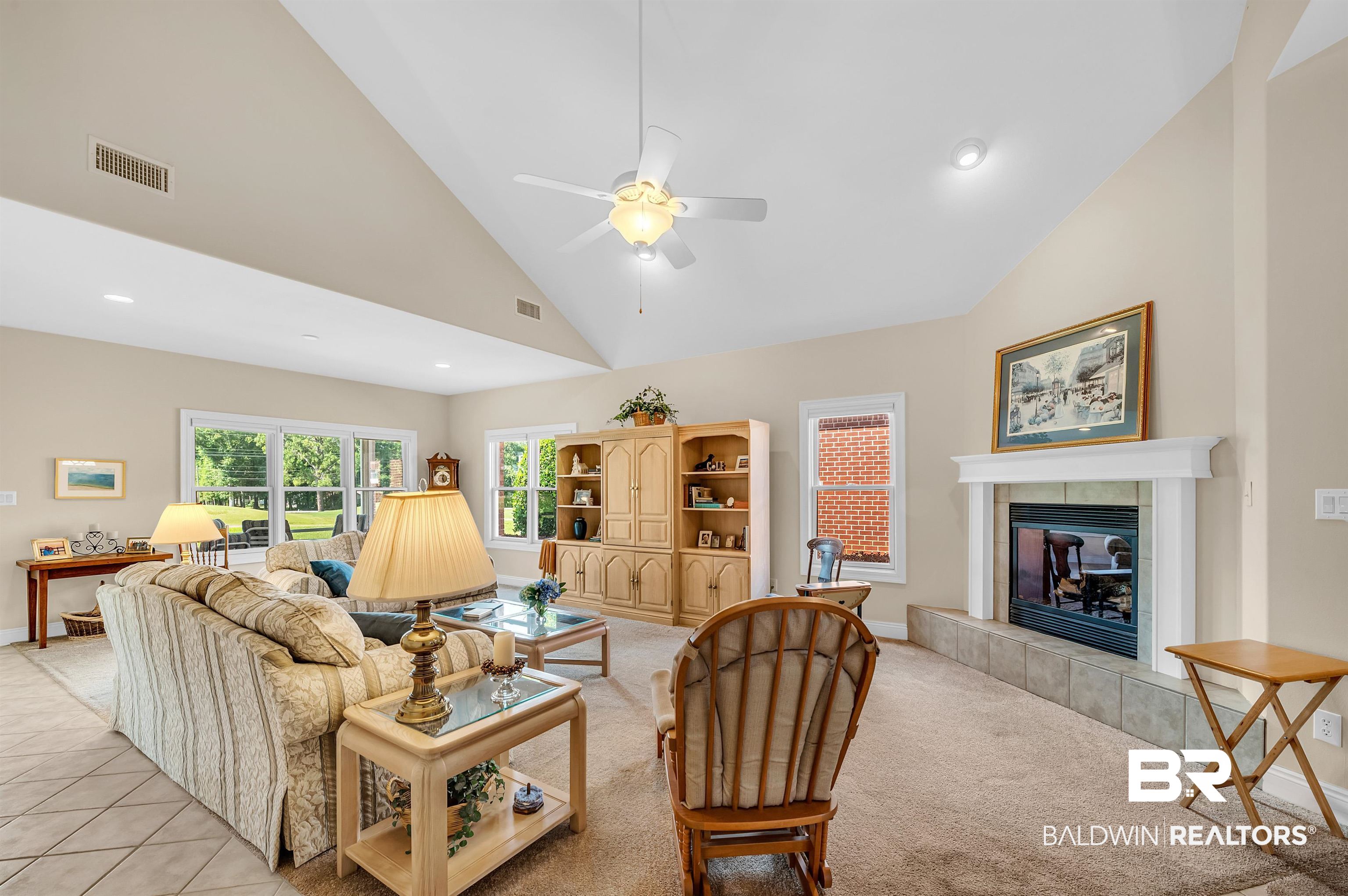 22739 Inverness Way Foley, AL 36535 - Photo 16 of 80 Living room with a fireplace, a ceiling fan, high vaulted ceiling, baseboards, and recessed lighting