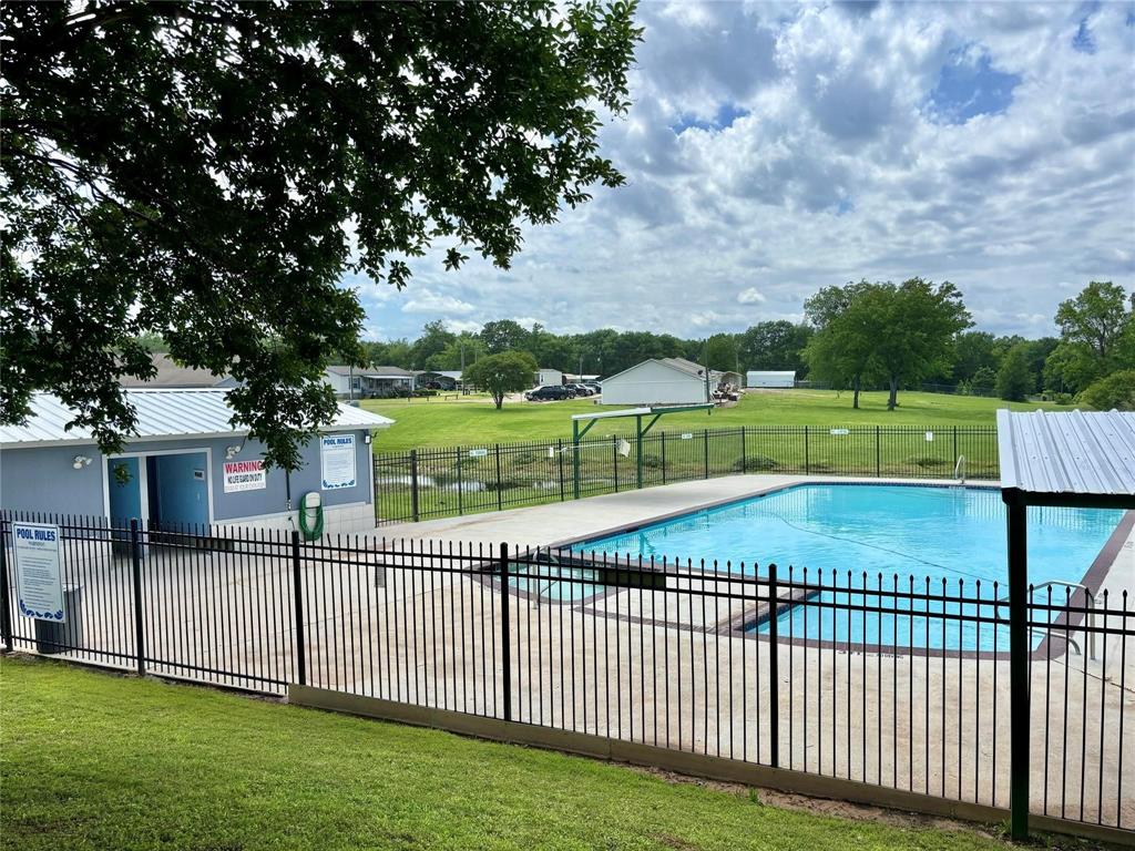 Tbd2 Blackfoot Quitman, TX 75783 - Photo 2 of 3 Pool featuring a lawn and fence