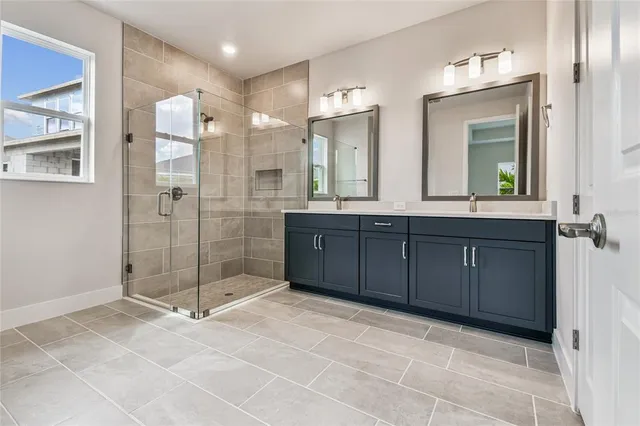 a bathroom with a shower and a sink