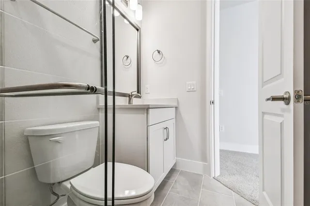 a view of a bathroom from a hallway