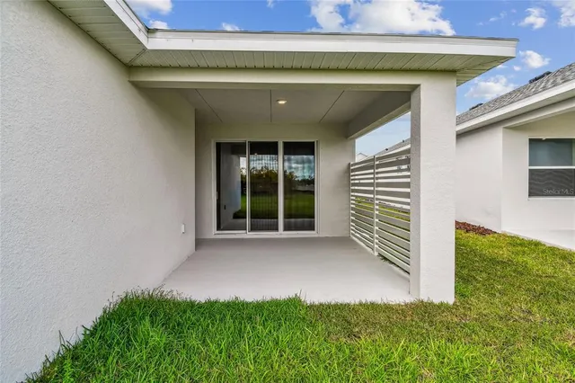 a front view of house with yard and outdoor seating
