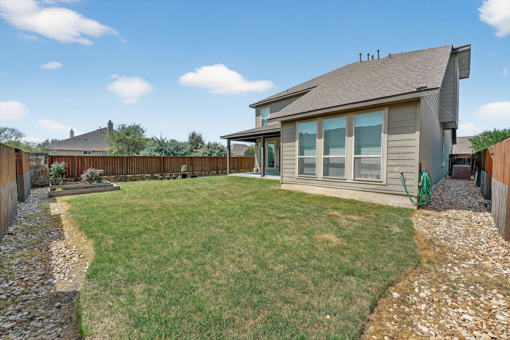 400 Cortona Lane Georgetown, TX 78628 - Photo 5 of 40 Rear view of house with a patio area, a fenced backyard, and roof with shingles