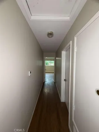 a view of gallery with wooden floor