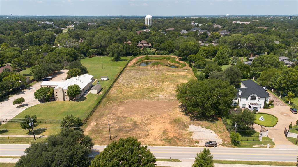 6200 Pleasant Run Road Colleyville, TX 76034 - Photo 2 of 10 an aerial view of a house with a yard and lake view