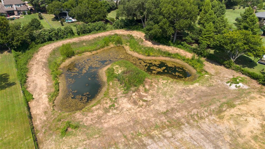 6200 Pleasant Run Road Colleyville, TX 76034 - Photo 9 of 10 a view of a swimming pool with a yard
