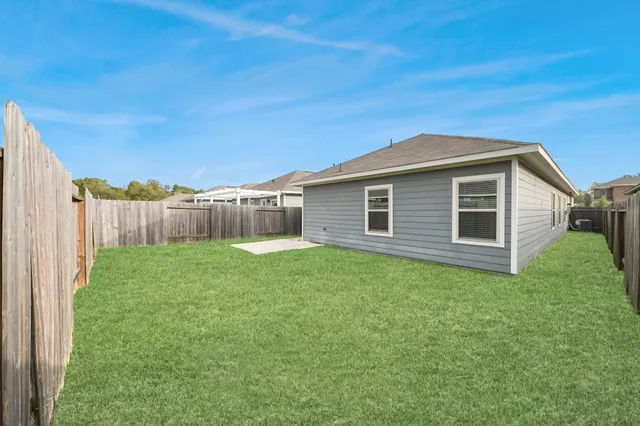 a backyard of a house with lots of green space