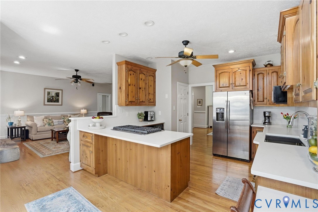 12123 Deer Ridge Court Ashland, VA 23005 - Photo 18 of 63 a kitchen with stainless steel appliances granite countertop a sink stove and refrigerator