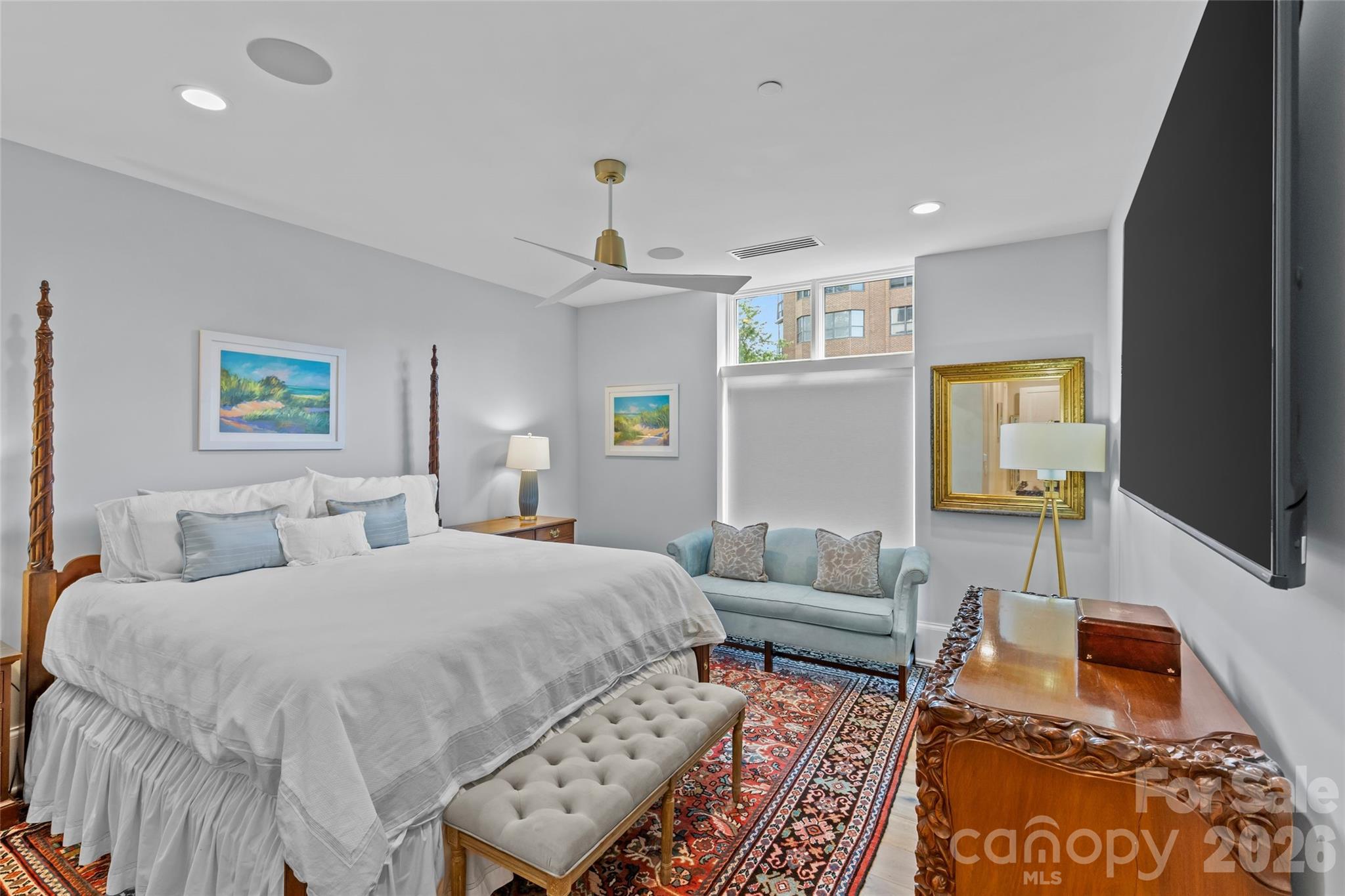 1500 Queens Road, Unit 104 Charlotte, NC 28207 - Photo 25 of 41 a bedroom with furniture and a rug