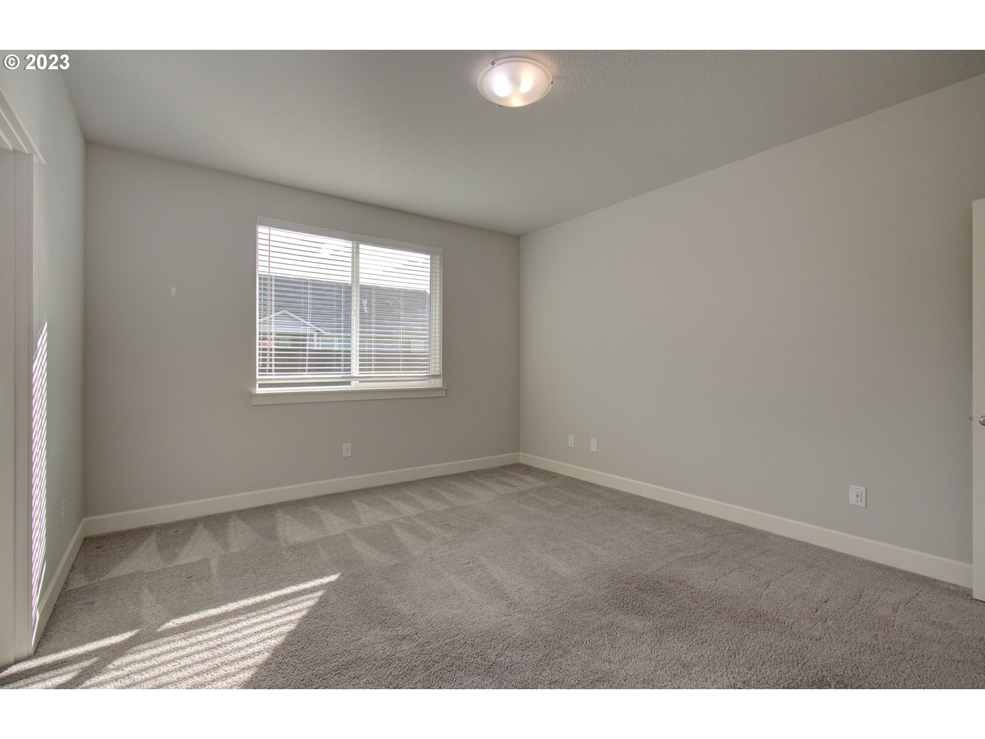 4823 South 16th Drive Ridgefield, WA 98642 - Photo 15 of 37 a view of an empty room with a window
