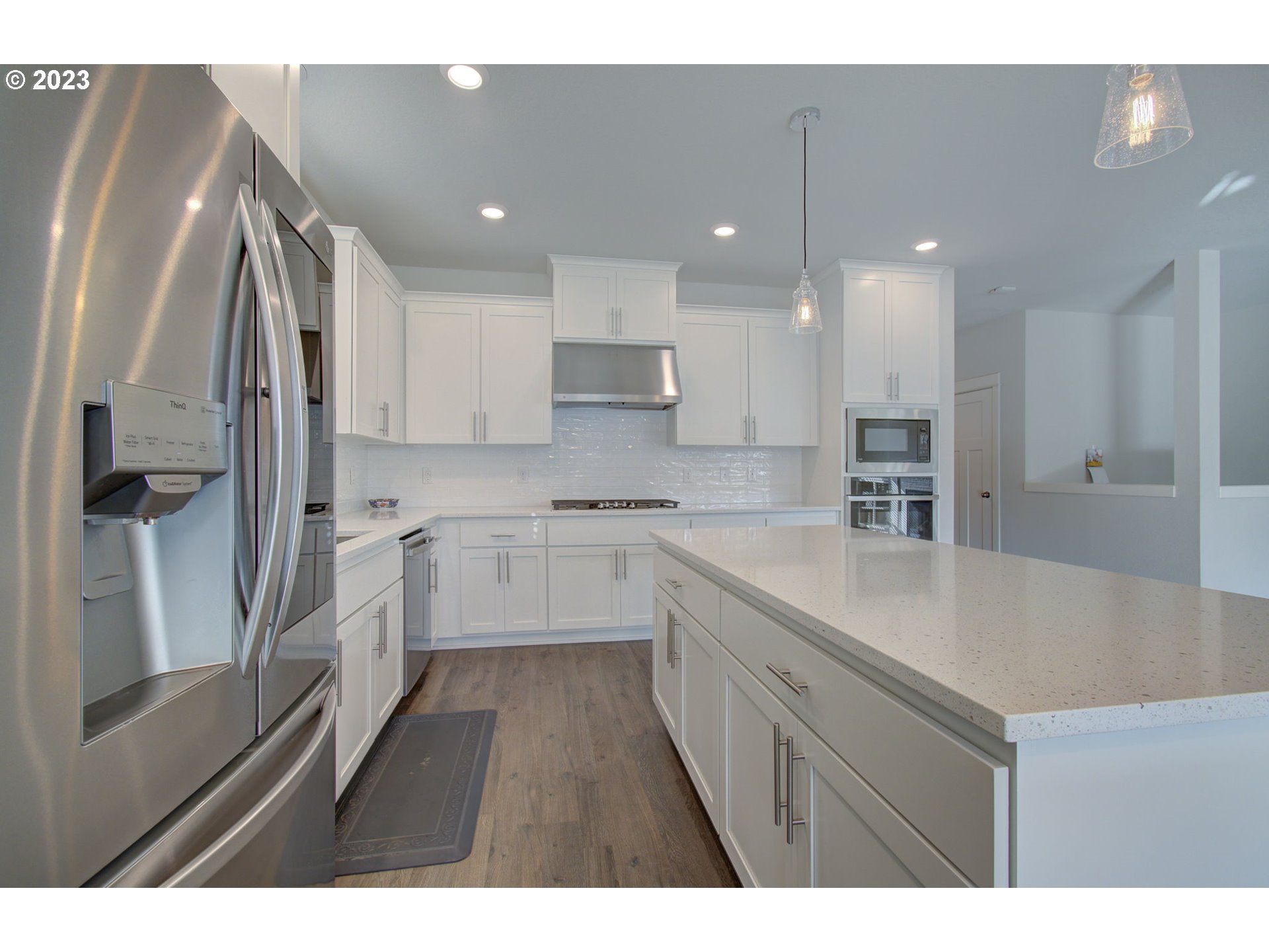 4823 South 16th Drive Ridgefield, WA 98642 - Photo 5 of 37 a kitchen with cabinets and a sink