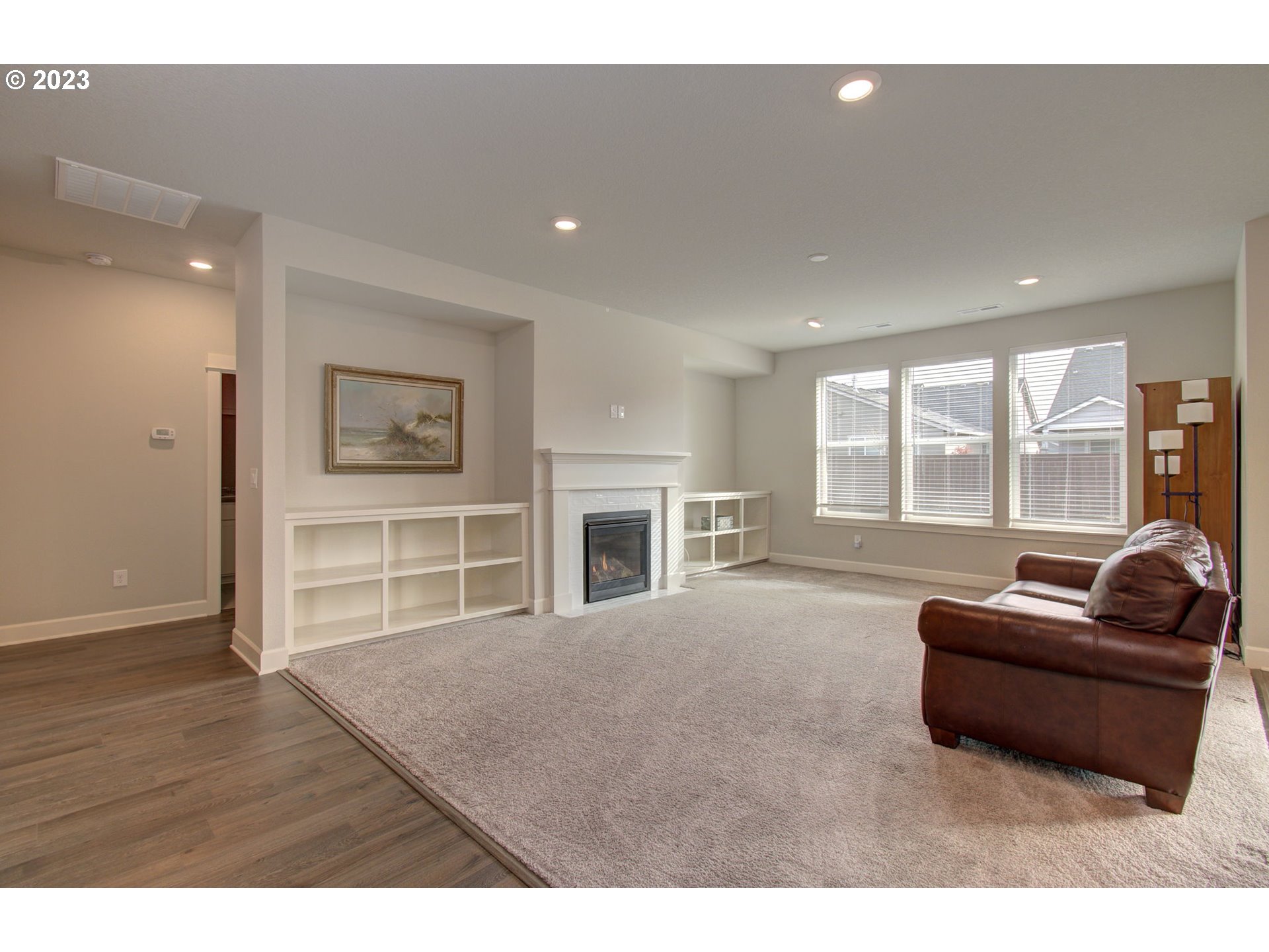 4823 South 16th Drive Ridgefield, WA 98642 - Photo 10 of 37 a living room with furniture and a flat screen tv