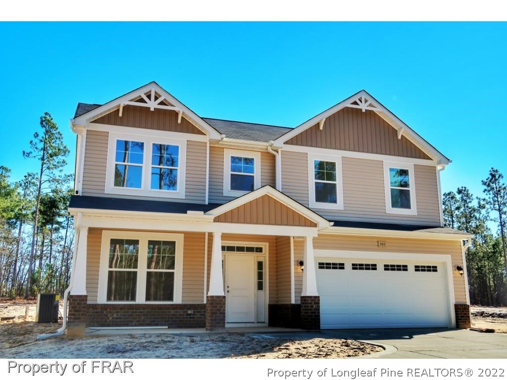 903 Montrose Road Raeford, NC 28376 - Photo 1 of 17 a front view of a house with a yard