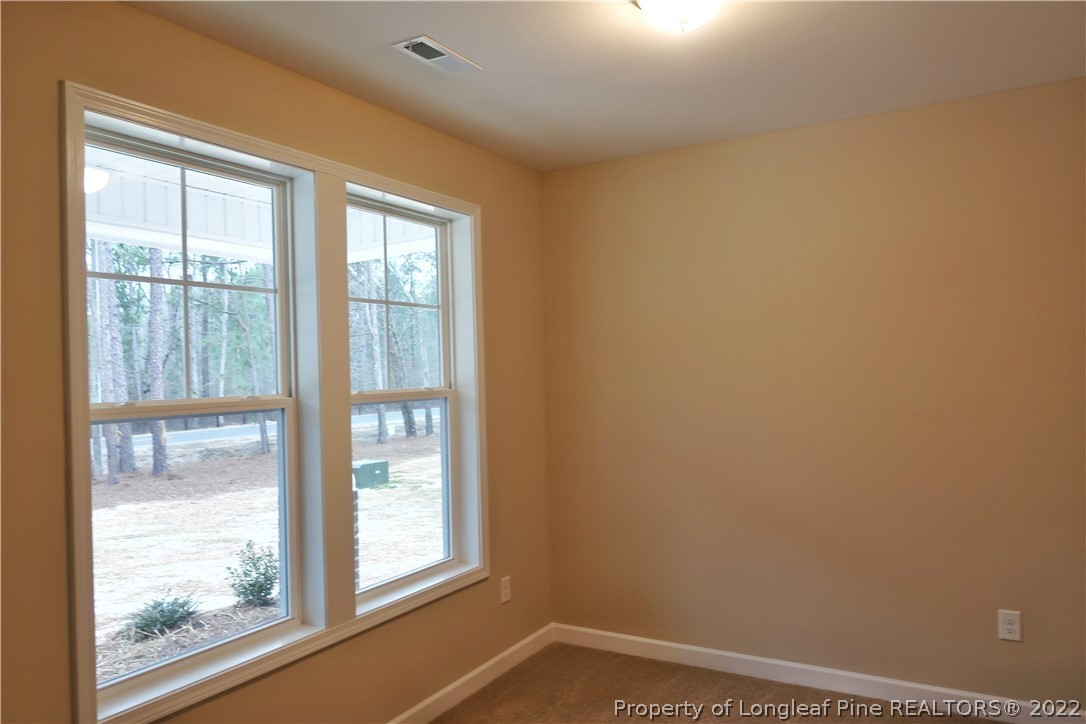 903 Montrose Road Raeford, NC 28376 - Photo 5 of 17 a view of empty room with window