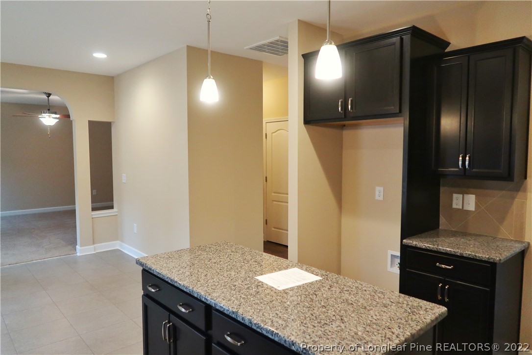 903 Montrose Road Raeford, NC 28376 - Photo 7 of 17 a bathroom with a granite countertop sink a shower and a mirror