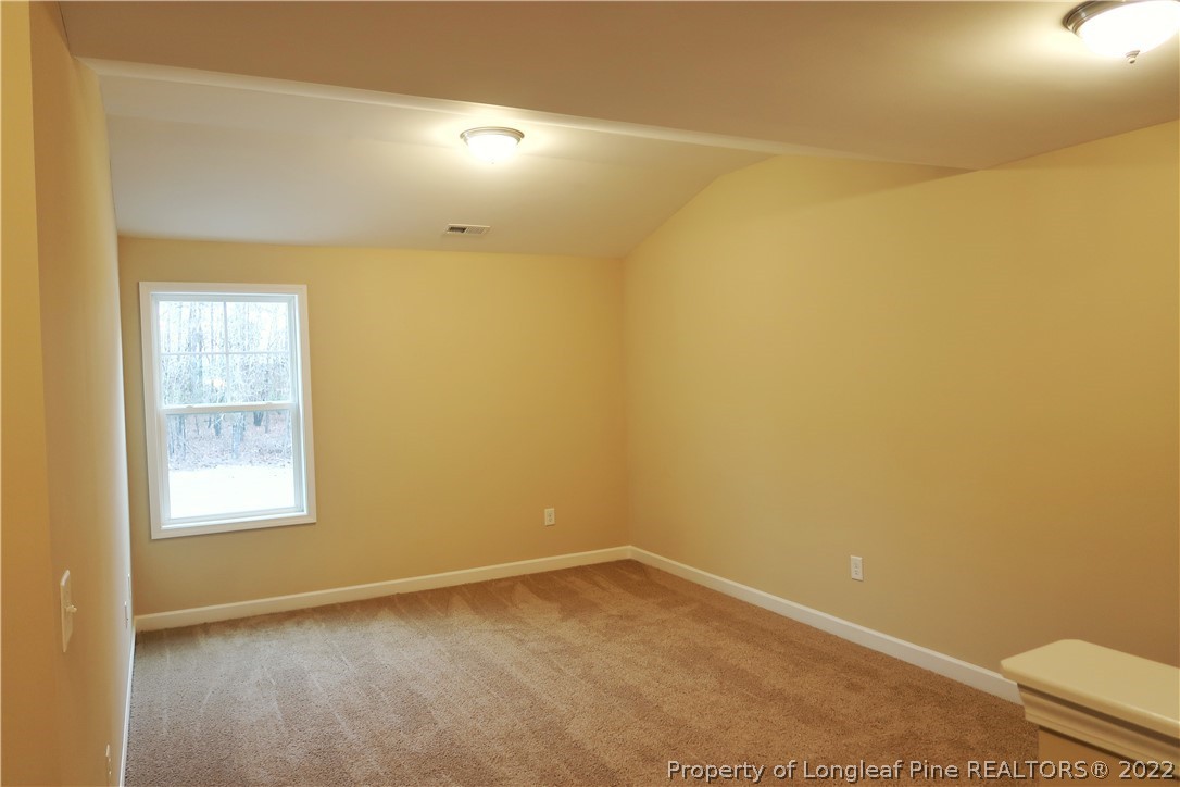 903 Montrose Road Raeford, NC 28376 - Photo 10 of 17 an empty room with a empty space and a window