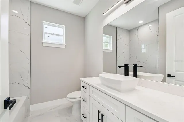 a view of balcony with wooden floor and fence