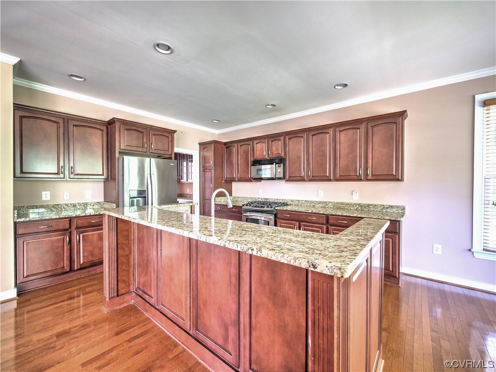 1024 Kingham Drive Midlothian, VA 23114 - Photo 15 of 41 a kitchen with granite countertop a sink stove and cabinets