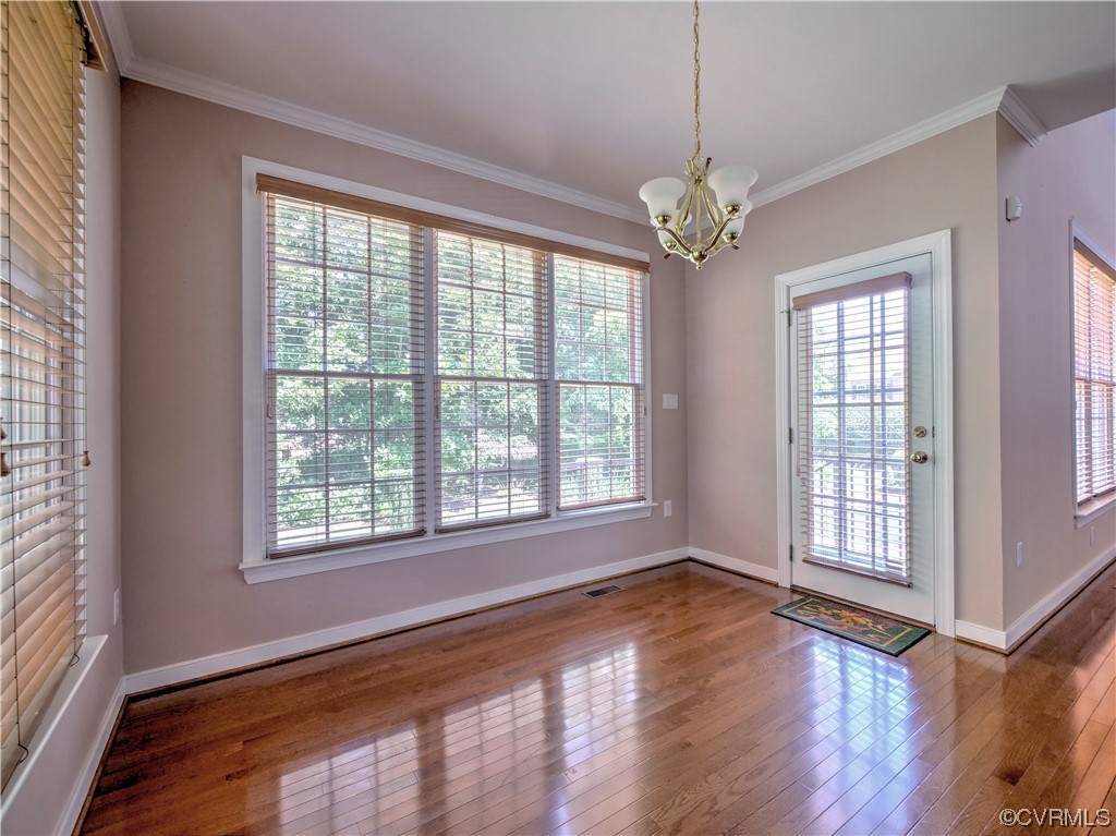 1024 Kingham Drive Midlothian, VA 23114 - Photo 18 of 41 a view of an empty room with wooden floor and a window