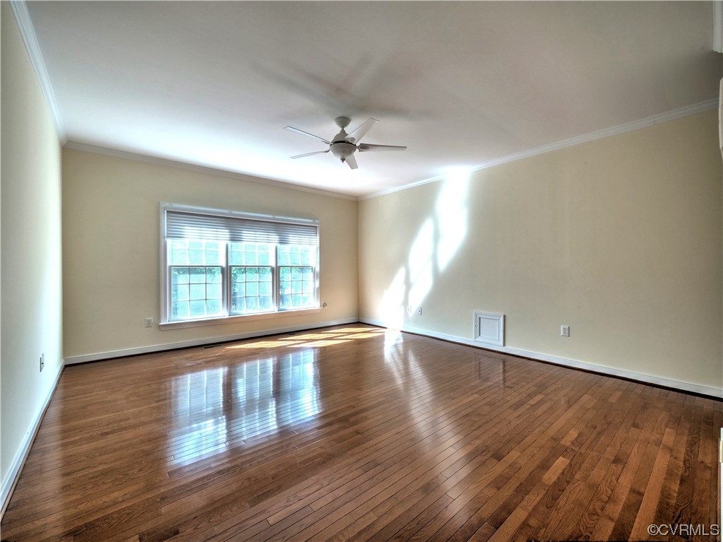 1024 Kingham Drive Midlothian, VA 23114 - Photo 21 of 41 an empty room with wooden floor and windows