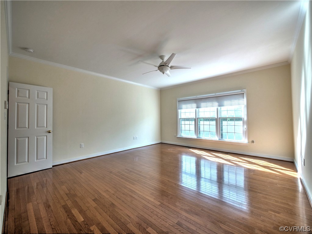 1024 Kingham Drive Midlothian, VA 23114 - Photo 22 of 41 an empty room with wooden floor and windows