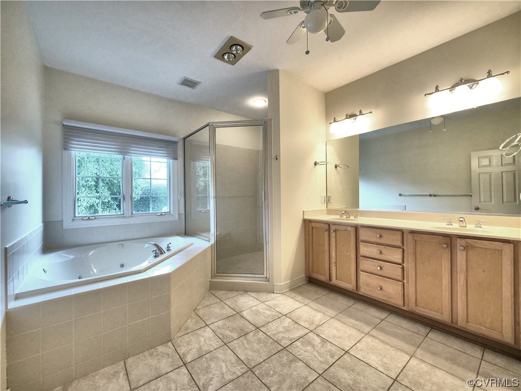 1024 Kingham Drive Midlothian, VA 23114 - Photo 24 of 41 a large bathroom with a large tub sink vanity and granite