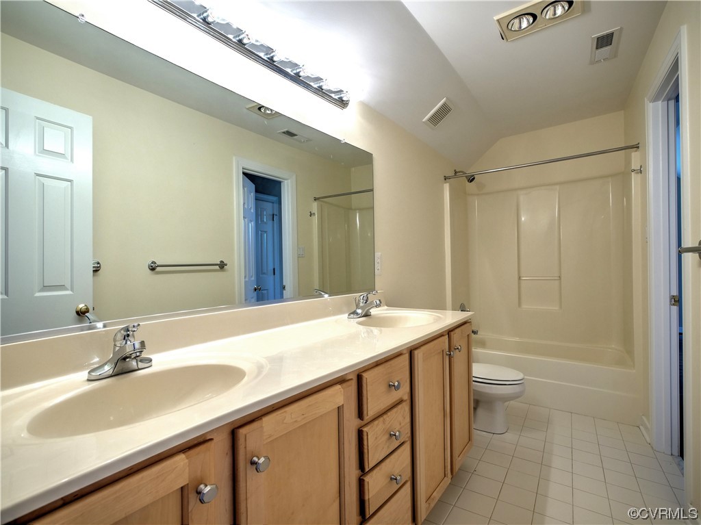 1024 Kingham Drive Midlothian, VA 23114 - Photo 27 of 41 a bathroom with a sink double vanity granite tub shower and a mirror